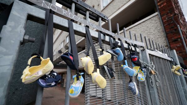 Baby shoes hang from the railings on Sean McDermott Street in Dublin in memory of the children who died at the Bon Secours Mother and Baby Home in Tuam, Co Galway, during the visit of Pope Francis to Ireland.