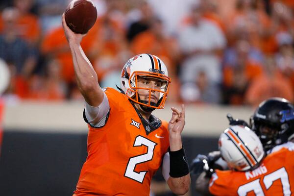 Oklahoma State quarterback Mason Rudolph (2) throws during an NCAA college football game between Tulsa and Oklahoma State in Stillwater, Okla., Thursday, Aug. 31, 2017. (AP Photo/Sue Ogrocki)