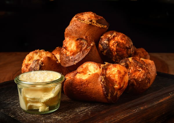 The recipe for King + Duke White Cheddar Popovers was created by Chrysta Poulos, director of pastry for Rocket Farm Restaurants. (Styling by Chrysta Poulos / Chris Hunt for The Atlanta Journal-Constitution)