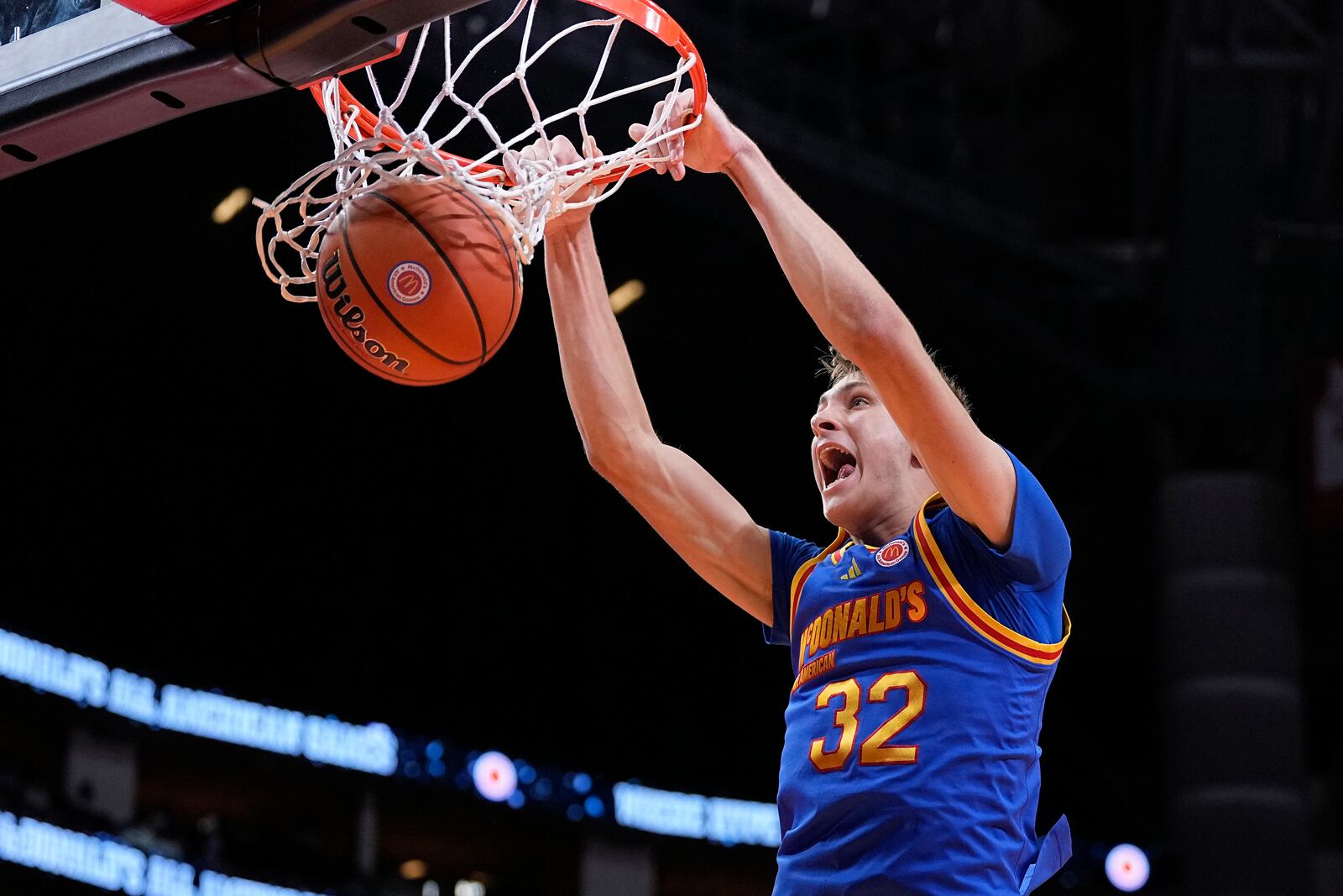 FILE - East forward Cooper Flagg dunks on a fast break during the third quarter of the McDonald's All American boys' basketball game Tuesday, April 2, 2024, in Houston. (AP Photo/Kevin M. Cox, File)