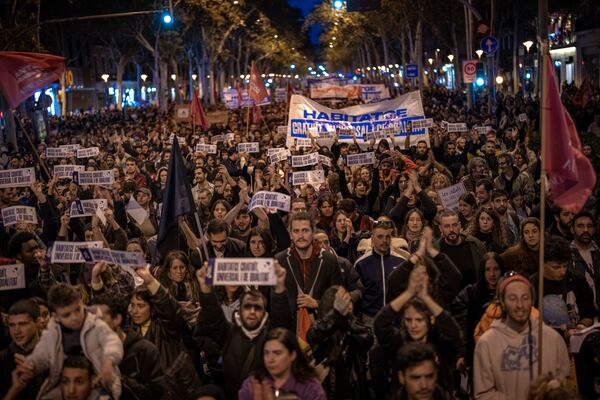 Demonstrators march to protest the skyrocketing cost of renting an apartment in Barcelona, Spain, Saturday, Nov. 23, 2024. (AP Photo/Emilio Morenatti)