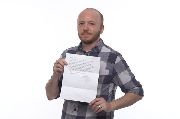 James Sheffield holds a letter written by his father in response to Sheffield’s coming out as a transgender. We asked various Atlantans to talk about their dads. RYON HORNE / RHORNE@AJC.COM