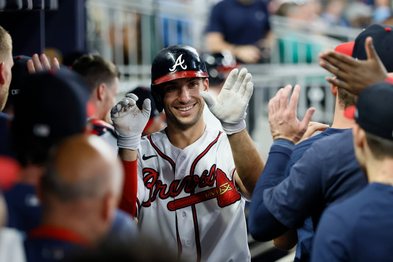 Braves first baseman Matt Olson (28) smiles as he celebrates his solo home run with teammates during the bottom of the seventh inning. Miguel Martinez / miguel.martinezjimenez@ajc.com 