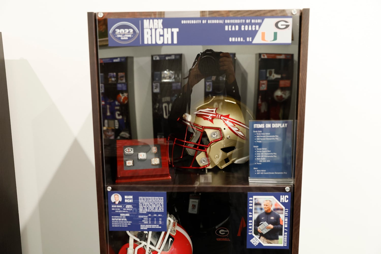 Items from a former University of Georgia coach Mark Richt are displayed as part of the 2023 class at the College Football Hall of Fame on Thursday, Sept. 28, 2023, in Atlanta. Miguel Martinez /miguel.martinezjimenez@ajc.com