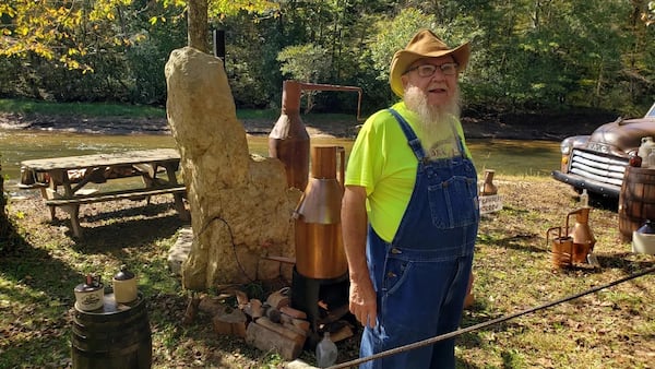 During the Sorghum Festival in Blairsville, sorghum syrup makers make the syrup while attendees watch.