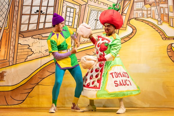 Olivier Award-winner Clive Rowe (right) performs as Dame Sarah the Cook during a photocall for Hackney Empire's Dick Whittington and His Cat in London, Tuesday, Dec. 3, 2024. (AP Photo/Thomas Krych)