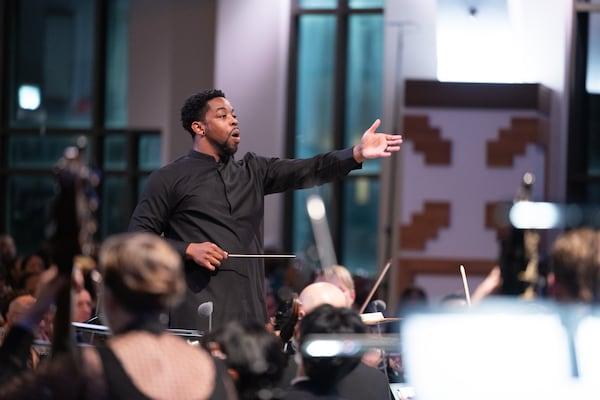 Conductor Jonathan Taylor Rush leads the ensembles during the King Celebration concert.