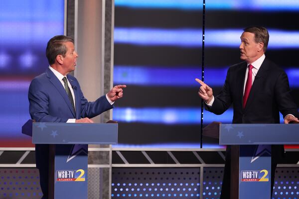 Former U.S. Sen. David Perdue, who is challenging the reelection bid by Gov. Brian Kemp, left, opened their debate Sunday by repeating falsehoods about voting fraud in the 2020 presidential election in Georgia. Perdue attacked Kemp for not calling a special session of the Legislature to overturn the results, which have been verified through three recounts and rulings in numerous court cases. (Miguel Martinez/Atlanta Journal Constitution/TNS)