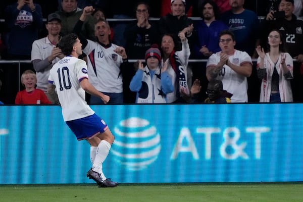 United States' Christian Pulisic (10) celebrates after scoring during the first half in a CONCACAF Nations League quarterfinal second leg soccer match against Jamaica Monday, Nov. 18, 2024, in St. Louis. (AP Photo/Jeff Roberson)