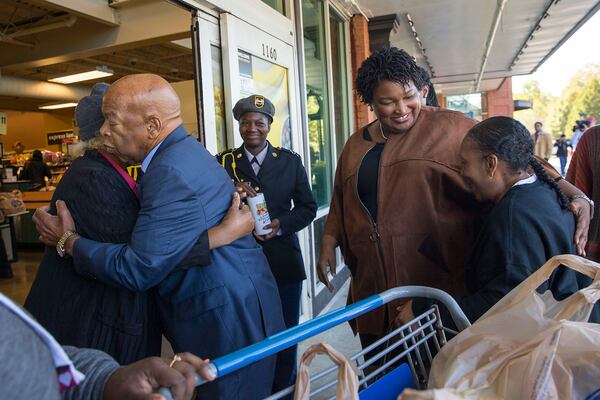 Gubernatorial candidate Stacey Abrams and U.S. Rep. John Lewis greet supporters outside of Kroger, Saturday, November 3, 2018. (ALYSSA POINTER/ALYSSA.POINTER@AJC.COM)