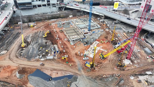 The Centennial Yards construction site is bustling as the projects reach important milestones. What was once a parking lot in the Gulch is now a scene filled with construction workers and heavy machinery, as observed on Wednesday, Dec. 18, 2024. 
(Miguel Martinez / AJC)