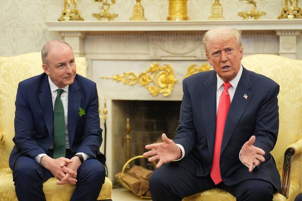 Taoiseach Micheal Martin, left, attends a bilateral meeting with President Donald Trump ahead of the White House St Patrick's Day reception, Wednesday March 12, 2025, in Washington. (Niall Carson/PA via AP)