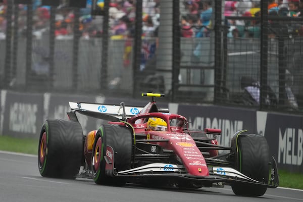 Ferrari driver Lewis Hamilton of Britain steers his car during the Australian Formula One Grand Prix at Albert Park, in Melbourne, Australia, Sunday, March 16, 2025. (AP Photo/Asanka Brendon Ratnayake)