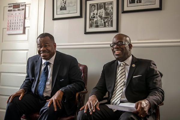 Brothers Darrell Watkins, left, and Sylvania Watkins, right, share a laugh while speaking about the hard work they put in at the start of their family's mortuary business at the Willie A. Watkins Funeral Home in Atlanta's West End community, Tuesday, July 21, 2020. (ALYSSA POINTER / ALYSSA.POINTER@AJC.COM)