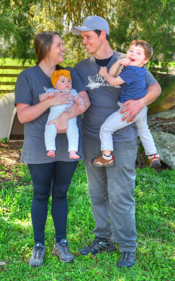 Grateful Pastures owners Sabrina Terry and Shaun Terry take a breather with their 3-year-old son, Jackson, and infant daughter, Lilah. Chris Hunt for The Atlanta Journal-Constitution