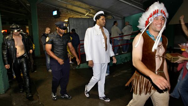 New York Yankees rookie pitcher Alfredo Aceves (right), dressed as the Indian from the 1970's musical group the Village People as he leaves with his rookie teammates in costume as the rest of the band after a baseball game against the Boston Red Sox in Boston in 2008.