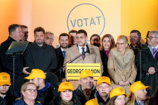 George Simion, the Alliance for the Unity of Romanians (AUR) candidate for president speaks to media after polls closed during the country's presidential elections, in Bucharest, Romania, Sunday, Nov. 24, 2024. (AP Photo/Andreea Alexandru)