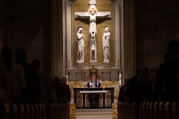 Rev. Juan Carlos Villota Viteri gives an Ash Wednesday service at the Cathedral of Christ the King in Atlanta on Wednesday, March 5, 2025. (Arvin Temkar/AJC)