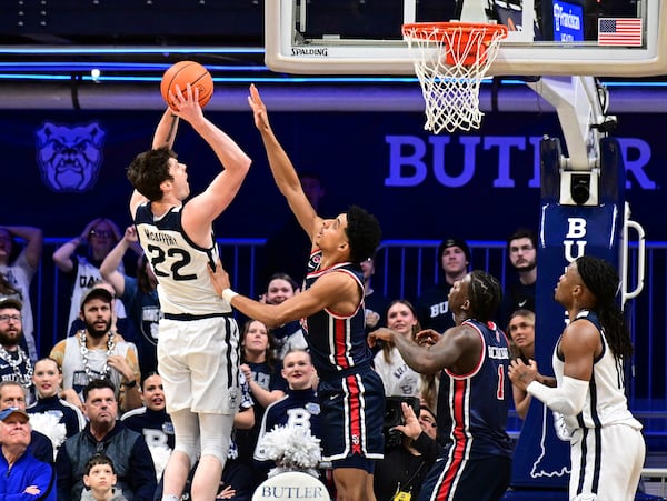 Butler forward Patrick McCaffery (22) shoots the ball over St. John's guard RJ Luis Jr. during the second half of an NCAA college basketball game, Wednesday, Feb. 26, 2025, in Indianapolis, Ind. (AP Photo/Marc Lebryk)