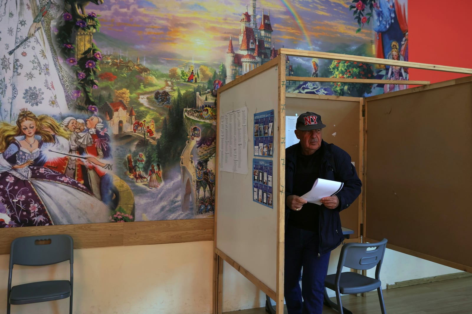 A man prepares to cast his ballot at a polling station during the general elections in Sofia, Sunday, Oct. 27, 2024. (AP Photo/Valentina Petrova)