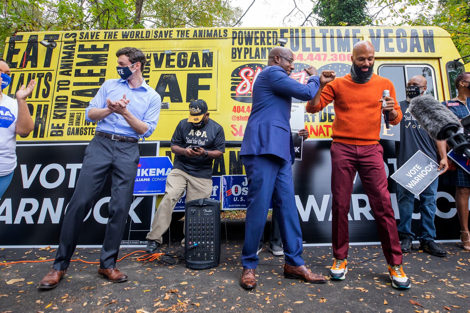 Democratic Georgia U.S. Senate candidates the Rev. Raphael Warnock (center) and Jon Ossoff (left) participate in a campaign event with rapper Common (right) in Jonesboro, Georgia, on October 27, 2020. (ERIK LESSER / EUROPEAN PRESSPHOTO AGENCY