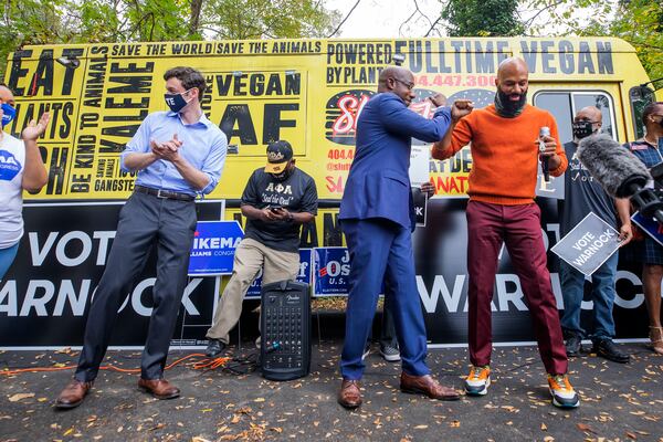 Democratic Georgia U.S. Senate candidates the Rev. Raphael Warnock (center) and Jon Ossoff (left) participate in a campaign event with rapper Common (right) in Jonesboro, Georgia, on October 27, 2020. (ERIK LESSER / EUROPEAN PRESSPHOTO AGENCY