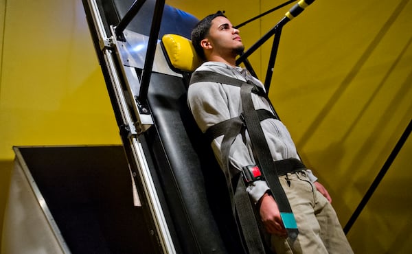 In this file photo, Jose Abdiel Santiago's facial expressions are recorded as he falls backwards in an interactive display in the Goosebumps: The Science of Fear exhibit at the Fernbank Museum of Natural History in Atlanta in 2014. A new evening series will give adults an opportunity to try all sorts of fun experiments. JONATHAN PHILLIPS / SPECIAL