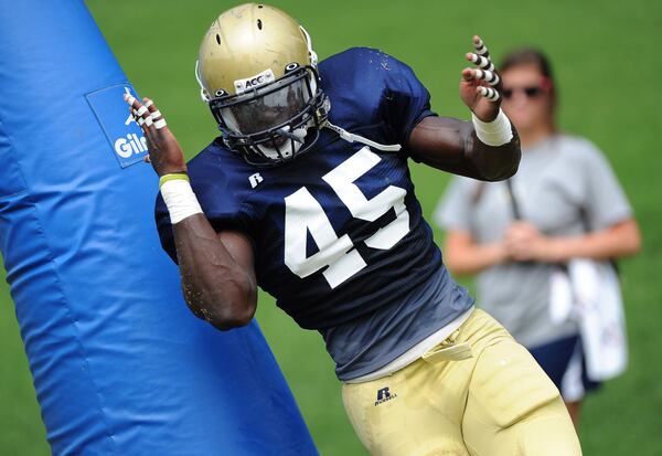 This isn't the best example, but former Georgia Tech defensive end Jeremiah Attaochu shows his bend in getting around a blocking dummy in a Tech practice in 2011.  AJC file photo by Johnny Crawford