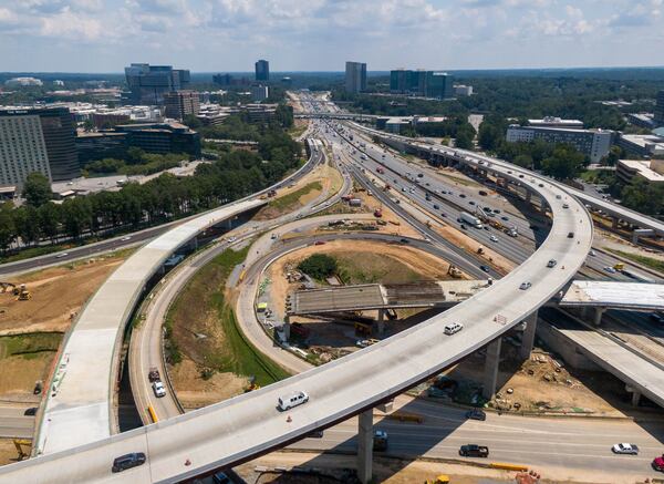 The rebuilding of the I-285/Ga. 400 interchange had been set for completion by the end of this year, but the contractors on the project recently told the Georgia Department of Transportation that the work could drag on until the third quarter of 2022. (Hyosub Shin / Hyosub.Shin@ajc.com)