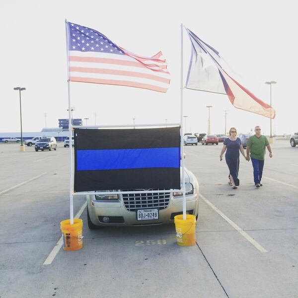  Mourners arrive at a service for fallen officer Brent Thompson in Corsicana, Tex. on July 10, 2016. Photo: Jennifer Brett