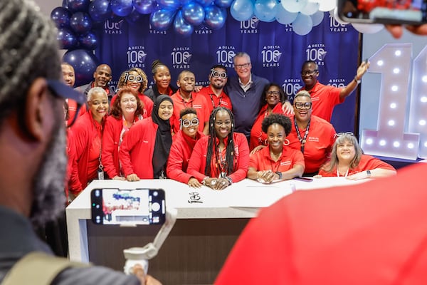 Employees pose for a photo with Delta Air Lines CEO Ed Bastian during the profit-sharing celebration at the Atlanta Customer Engagement Center in Hapeville on Friday, Feb. 14, 2025. (Natrice Miller/AJC)