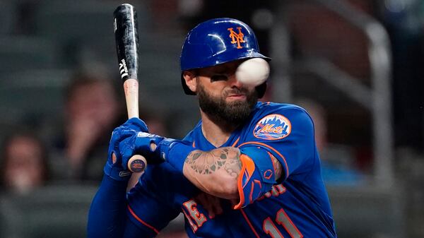 Kevin Pillar is hit in the face with a pitch from Braves reliever Jacob Webb in the seventh inning of Monday's Braves-Mets game at Truist Park.