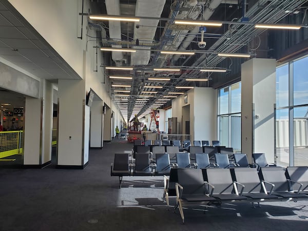 At Hartsfield-Jackson International Airport, workers put the finishing touches on gate areas to complete the first phase of a project to widen Concourse D on Sept. 4, 2024. (Courtesy)