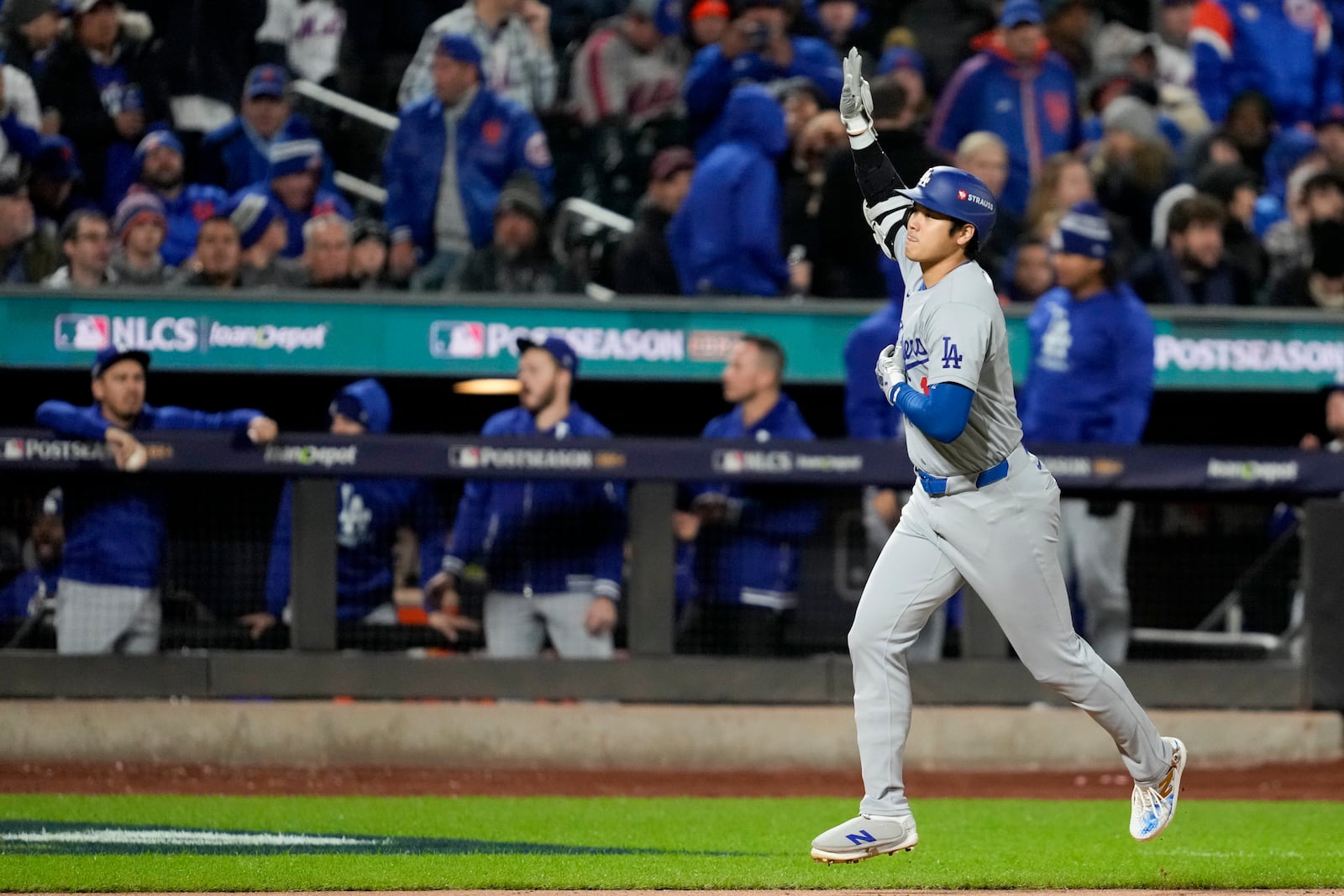 Los Angeles Dodgers' Shohei Ohtani celebrates his three-run home run against the New York Mets during the eighth inning in Game 3 of a baseball NL Championship Series, Wednesday, Oct. 16, 2024, in New York. (AP Photo/Ashley Landis)