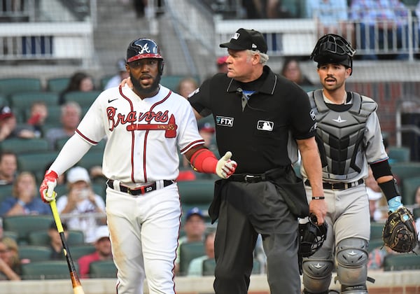 April 23, 2022 Atlanta - Atlanta Braves' left fielder Marcell Ozuna (20) reacts after he was hit by a pitch in the first inning at Truist Park on Saturday, April 23, 2022. (Hyosub Shin / Hyosub.Shin@ajc.com)