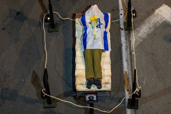 A display of a dead Israeli soldier during a protest in Tel Aviv, Israel, Saturday, March 8, 2025, demanding the immediate release of hostages held by Hamas in the Gaza Strip. (AP Photo/Ariel Schalit)