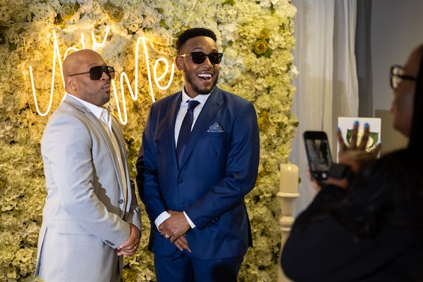 (L-R) TaRon Thompson and Scott Valentine have a Valentine’s Day wedding at Fulton County Courthouse in Atlanta on Friday, February 14, 2025. (Arvin Temkar / AJC)