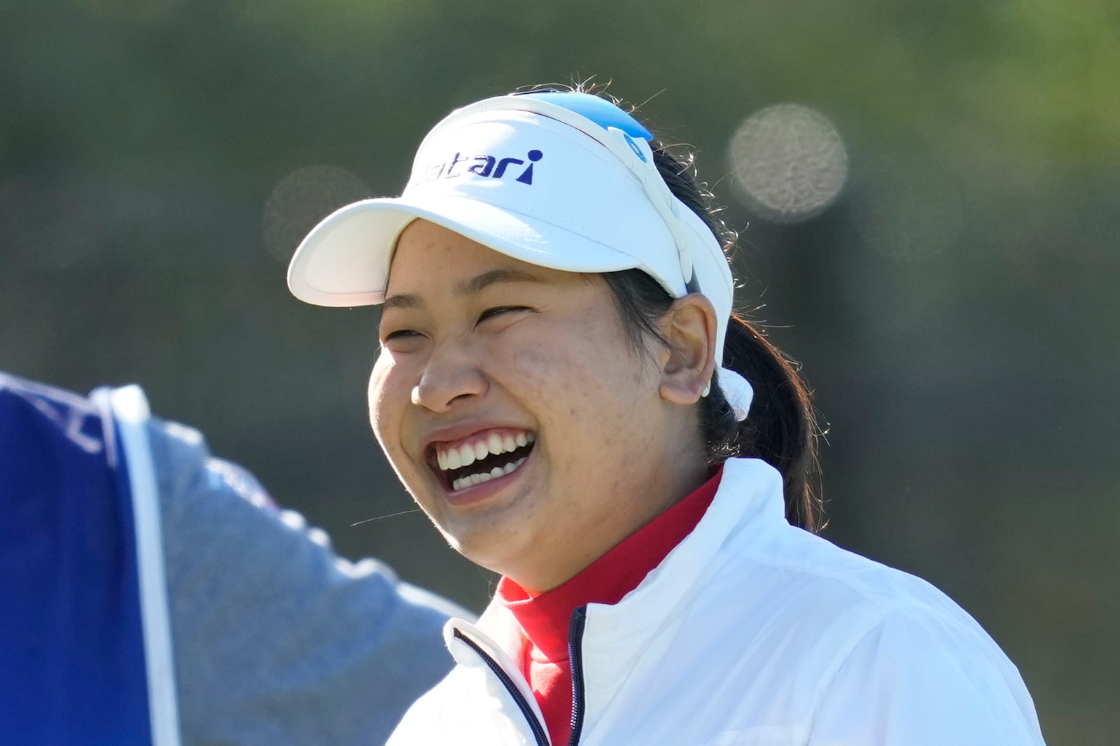 Chanettee Wannasaen of Thailand smiles on the second hole during the final round of the LPGA Ladies Championship golf tournament at the Seowon Valley Country Club in Paju, South Korea, Sunday, Oct. 20, 2024. (AP Photo/Lee Jin-man)