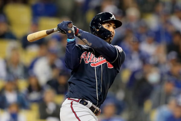 Braves left fielder Eddie Rosario hits a three-run home run in the ninth inning of Game 4 at the NLCS against the Los Angeles Dodgers Wednesday Oct. 20, 2021, in Los Angeles. (Curtis Compton / curtis.compton@ajc.com)