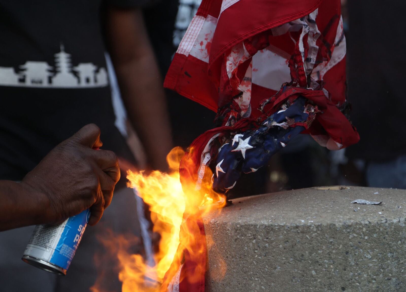 May 29, 2020 -  Atlanta -  After a peaceful march the Georgia State Capitol that swelled into the hundreds,  protestors returned to the area around the Centennial Olympic Park and CNN center where some confronted police, who sprayed some demonstrators with pepper spray.  They carried signs and chanted their messages of outrage over the death of George Floyd in Minneapolis.     Alyssa Pointer / alyssa.pointer@ajc.com