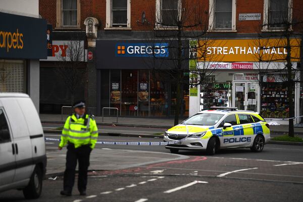 Police attend the scene after an incident in Streatham, London, Sunday Feb. 2, 2020. London police say officers shot a man during a âterrorism-related incidentâ that involved the stabbings of âa number of people.â (Victoria Jones/PA via AP)