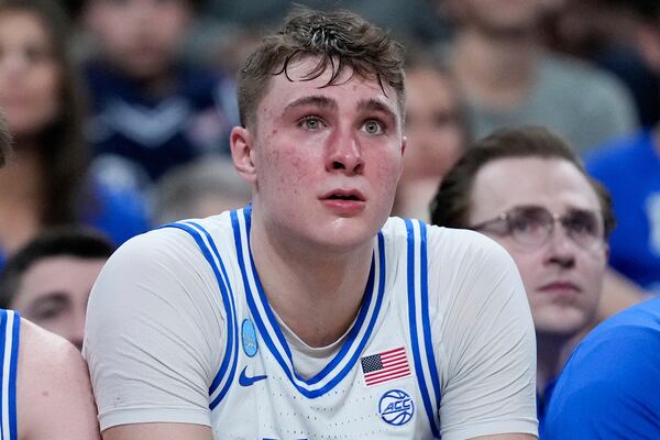 Duke forward Cooper Flagg watches from the bench during the first half in the second round of the NCAA college basketball tournament against Baylor, Sunday, March 23, 2025, in Raleigh, N.C. (AP Photo/Stephanie Scarbrough)