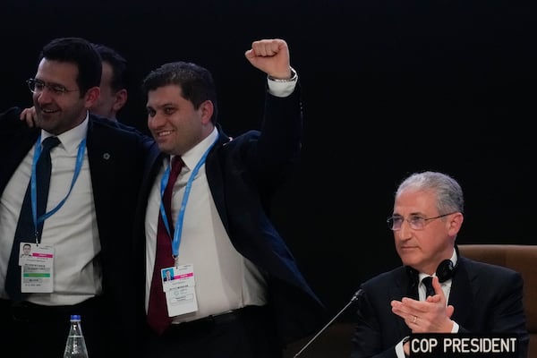 Mukhtar Babayev, COP29 President, applauds as he attends a closing plenary at the COP29 U.N. Climate Summit, Sunday, Nov. 24, 2024, in Baku, Azerbaijan. (AP Photo/Rafiq Maqbool)