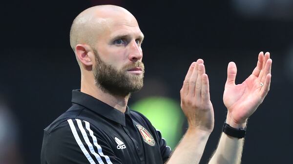 Atlanta United interim head coach Rob Valentino applauds his team and the fans after a 1-0 victory over Los Angeles FC during the second half Sunday, Aug. 15, 2021, at Mercedes-Benz Stadium in Atlanta. (Curtis Compton / Curtis.Compton@ajc.com)