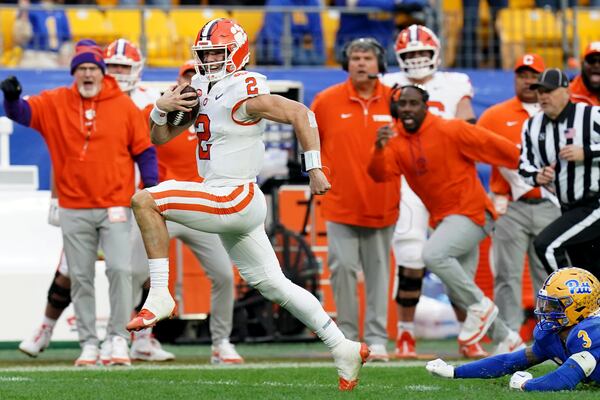 Clemson quarterback Cade Klubnik (2) gets past Pittsburgh defensive back Donovan McMillon (3) as he carries for a 50-yard touchdown during the second half of an NCAA college football game Saturday, Nov. 16, 2024, in Pittsburgh. (AP Photo/Matt Freed)