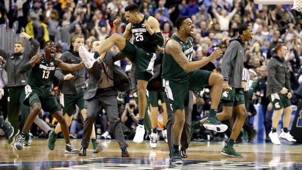 Michigan State's Nick Ward and Kenny Goins celebrate their team's 68-67 win over the Duke Blue Devils in the East Regional game of the 2019 NCAA Men's Basketball Tournament March 31, 2019, at Capital One Arena in Washington, DC.