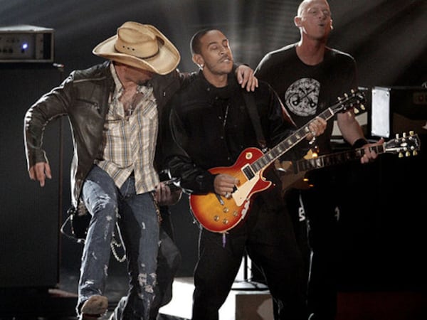 Jason Aldean, left, and Ludacris perform together at the Grammy nominations concert in 2011.