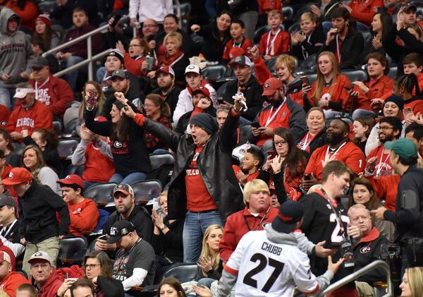 Georgia fans cheer as players arrive during Georgia Media Day at Philips Arena on Saturday, January 6, 2017, ahead of College Football Playoff Championship.