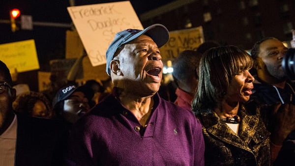 Rep.Cummings helps clear the streets of protesters on the same day Maryland state attorney Marilyn J Mosby announced charges would be filed against Baltimore police officers in the death of Freddie Gray.