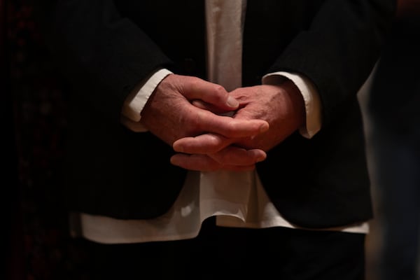 The hands of the artist Anselm Kiefer are seen during a press preview of the Anselm Kiefer exhibit in both the Van Gogh Museum and the Stedelijk Museum in Amsterdam, Netherlands, Wednesday, March 5, 2025. (AP Photo/Peter Dejong)